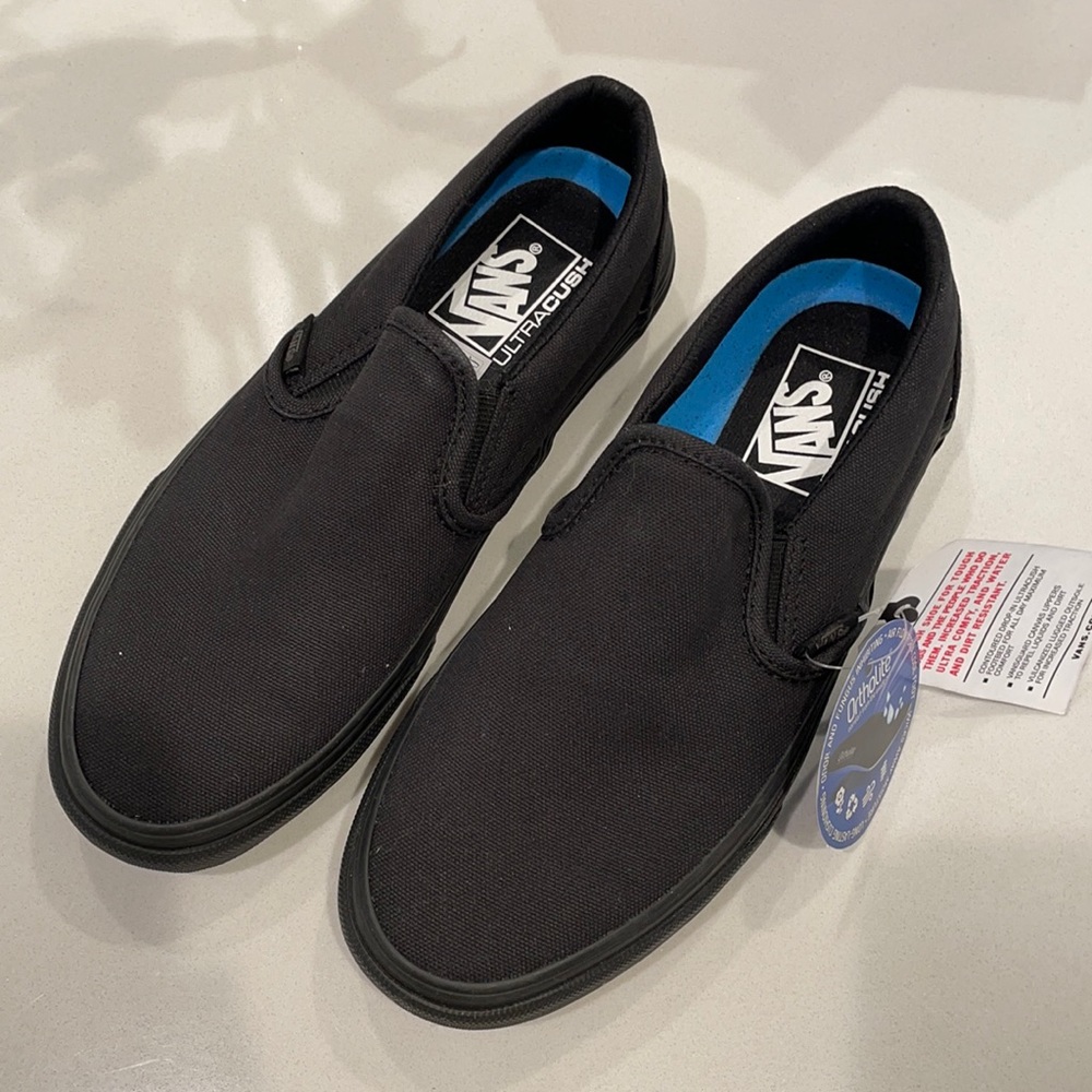 Vans slip on all black size 7 women’s and 5.5 in men’s. orthopedic sole